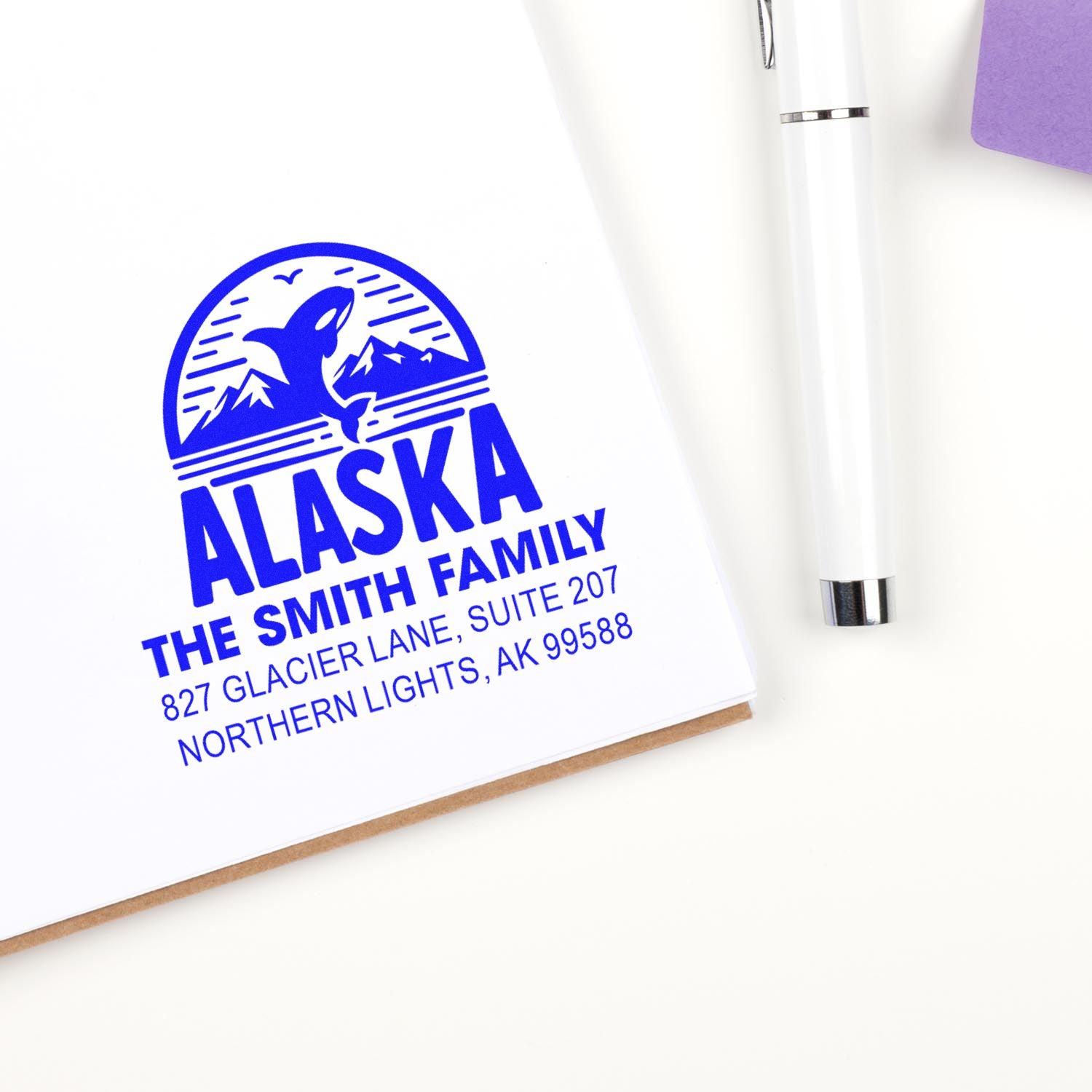 Custom Alaska family return address stamp with whale and mountains for personalized envelopes and mailing.