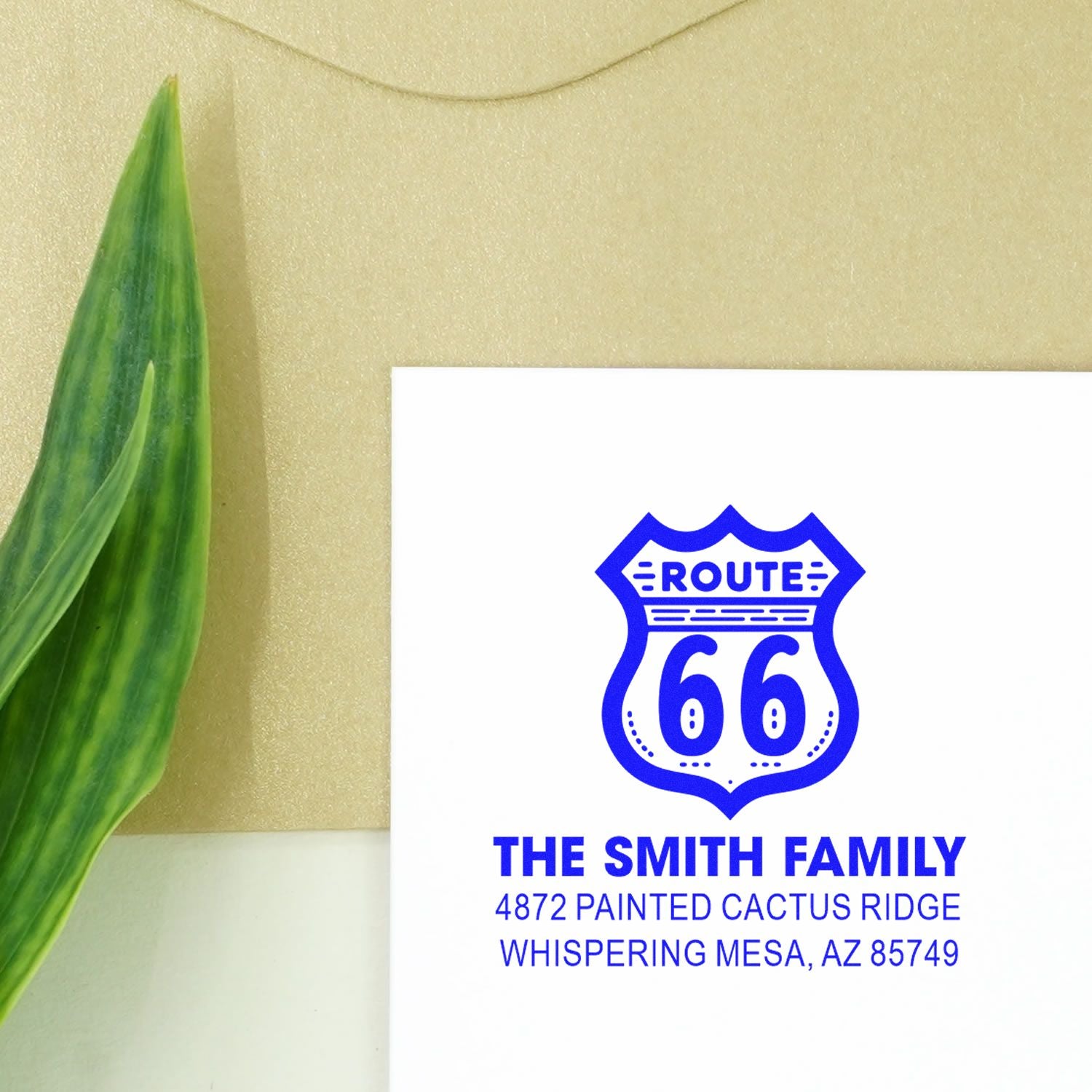 Custom rubber stamp with Route 66 shield and return address for personalized family mailing.
