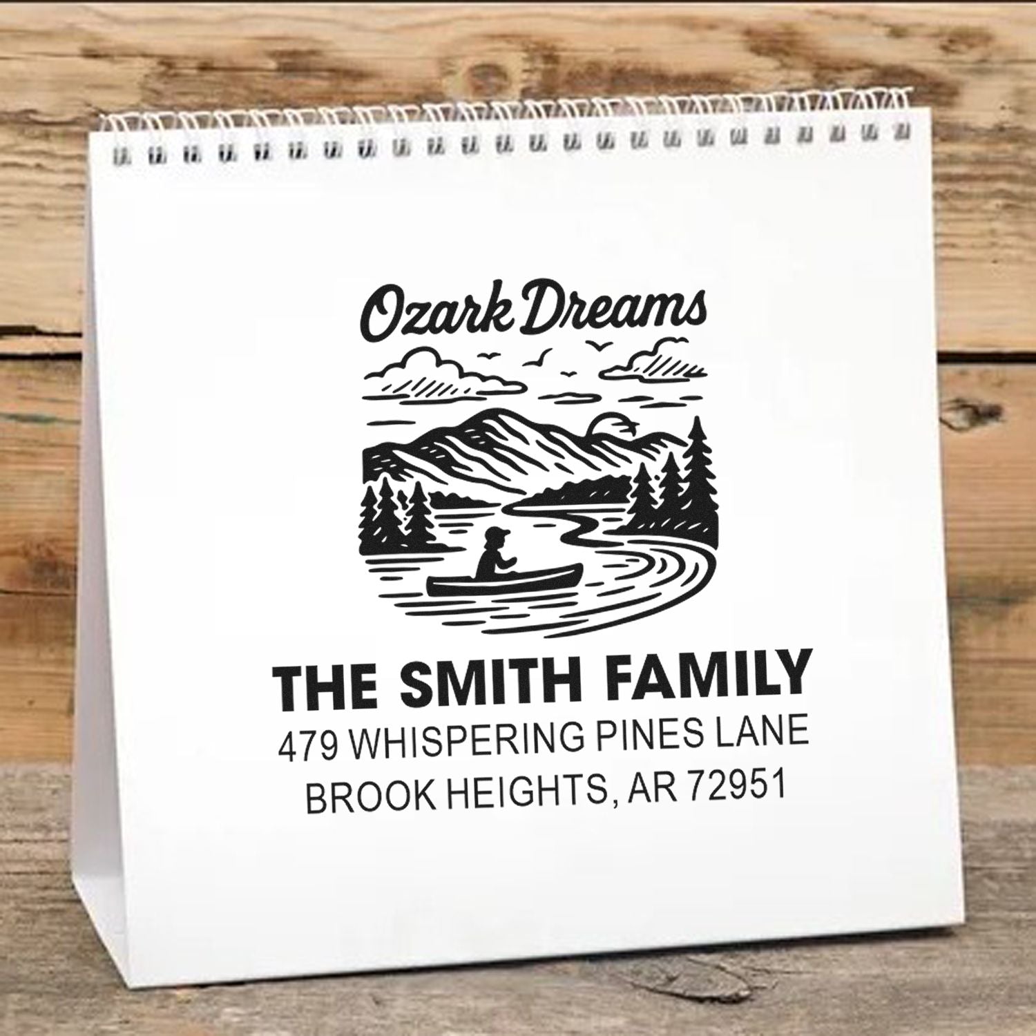 Personalized rubber stamp for custom paper gift bags featuring Ozark Dreams mountain canoe logo, family name, and address.