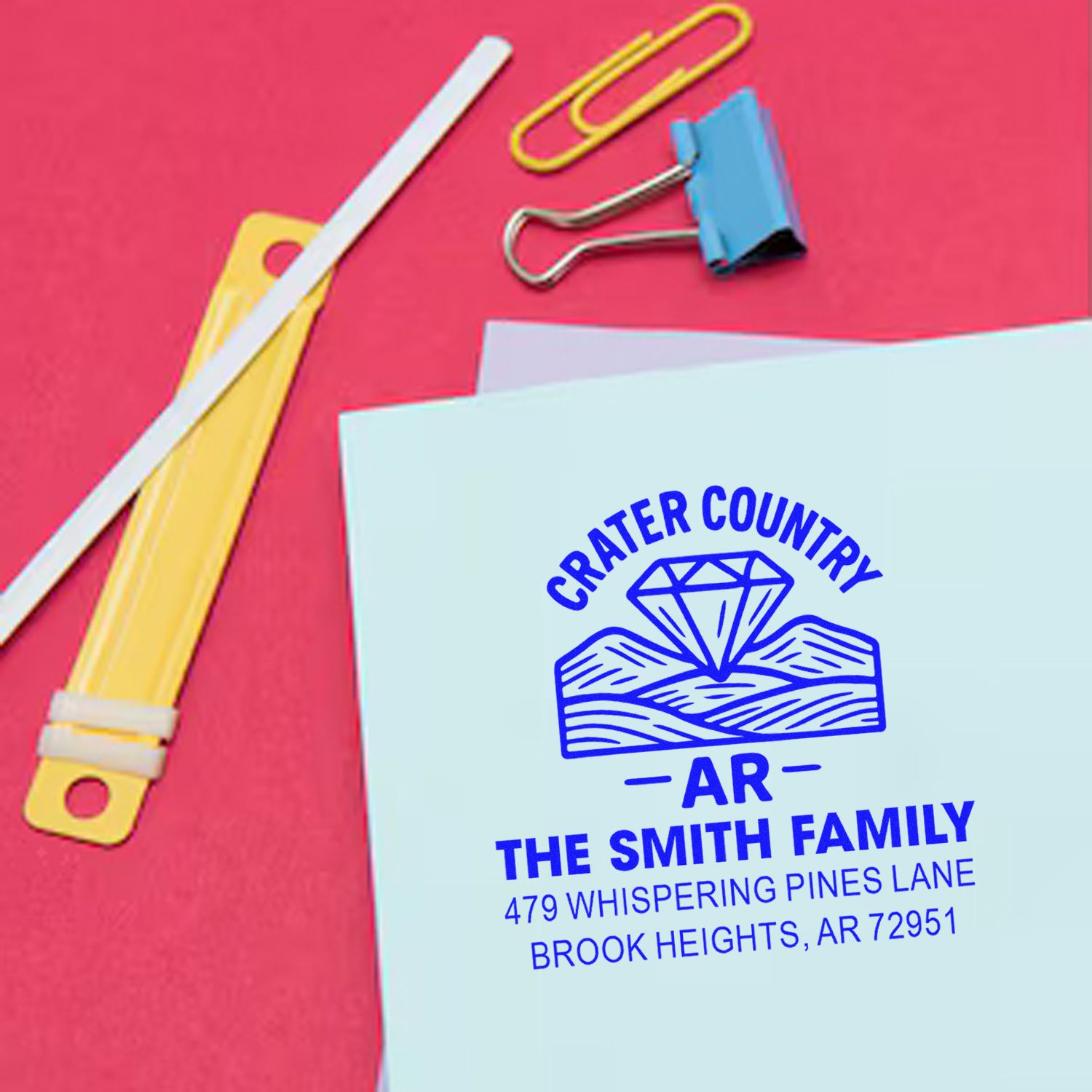 Custom return address rubber stamp on envelope, featuring family name and Arkansas address for personalized mail.