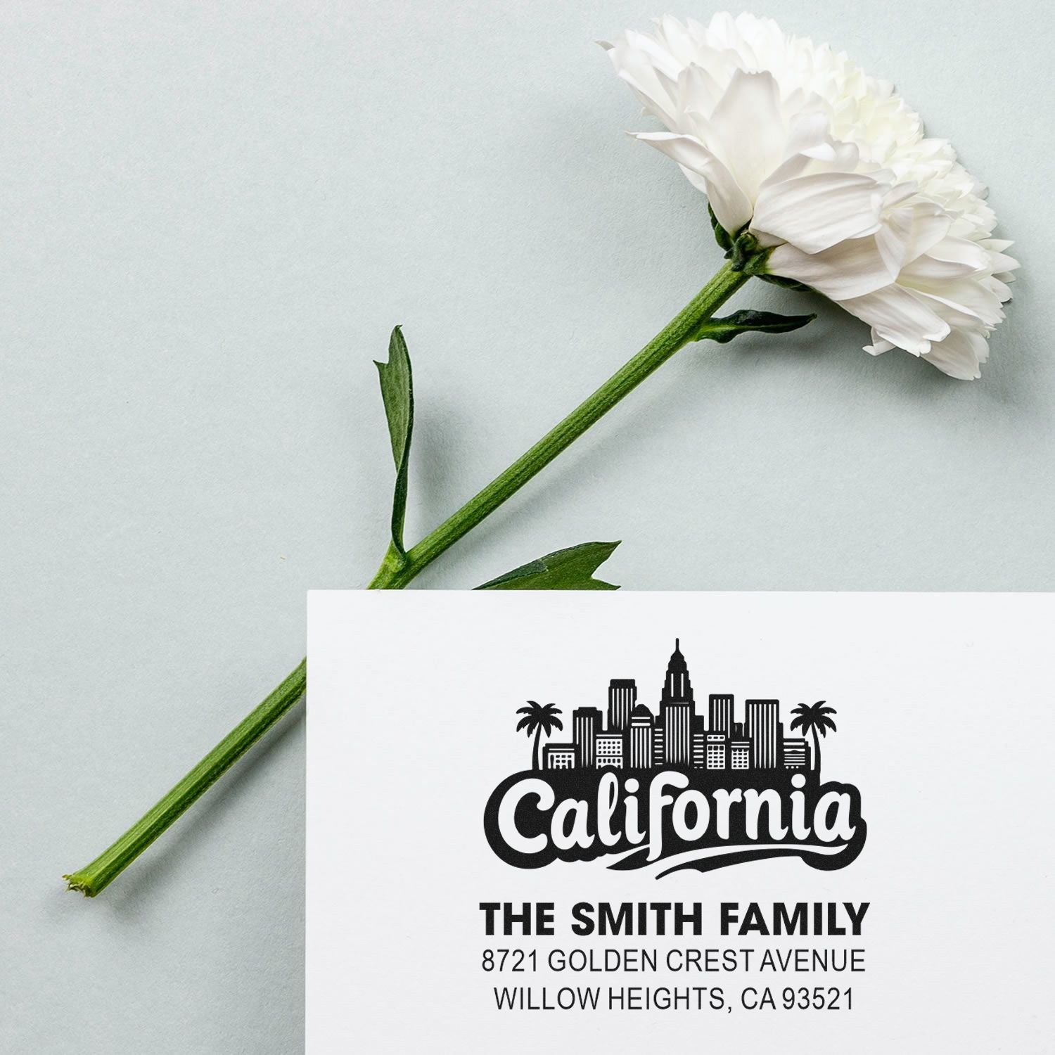 Custom California return address rubber stamp with skyline, palm trees, and The Smith Family address.