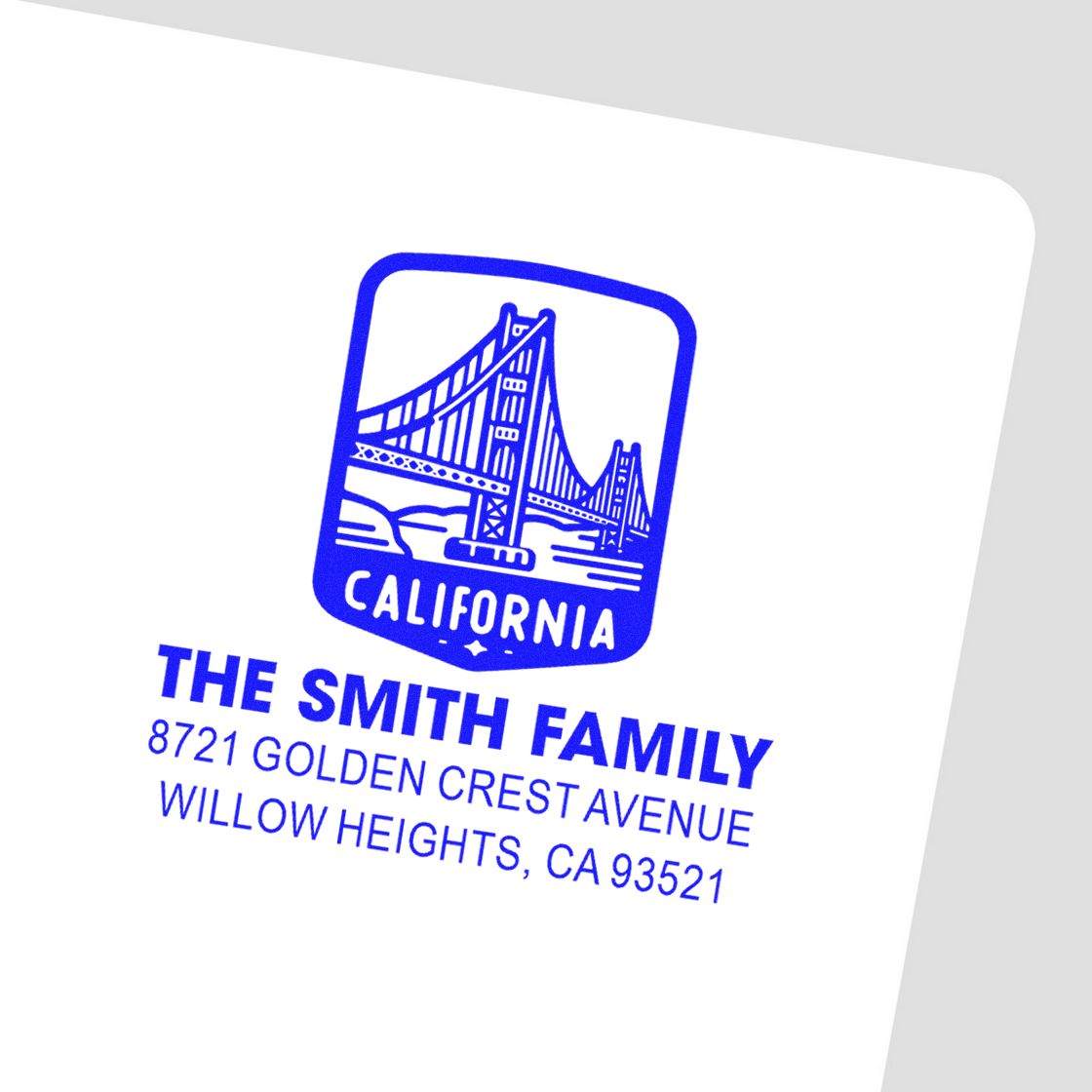 Custom California family return address rubber stamp with bridge logo for mailing and personalized envelopes.