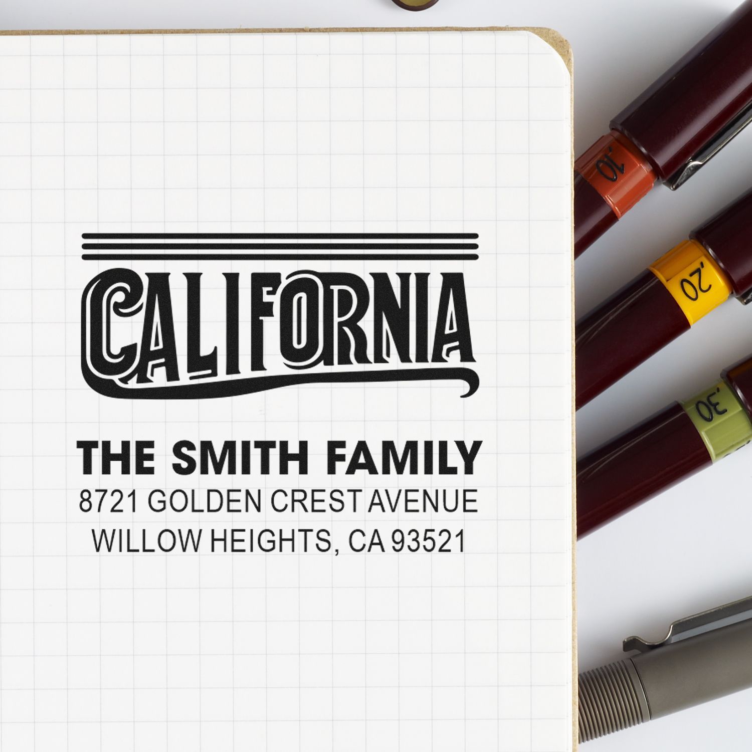 Custom California address rubber stamp for The Smith Family with name and street address for mailing, packaging, and return labels.