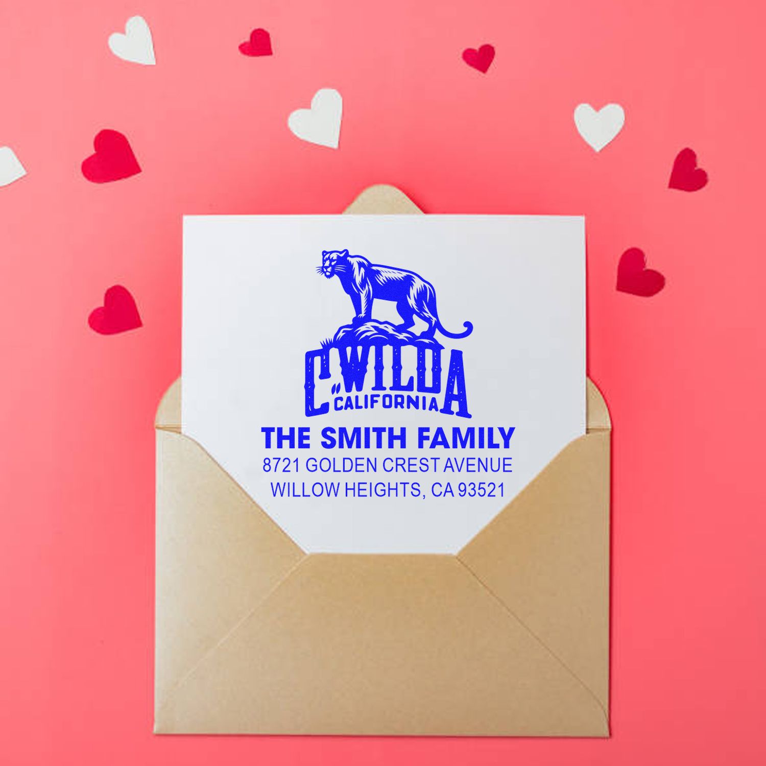 Custom family return address rubber stamp on envelope with California wildcat logo and The Smith Family address.