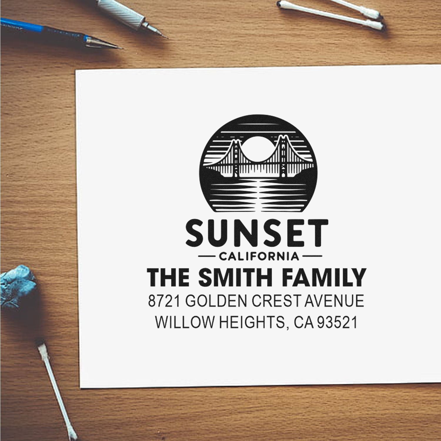 Personalized family return address rubber stamp featuring Sunset California bridge logo and Smith family address.