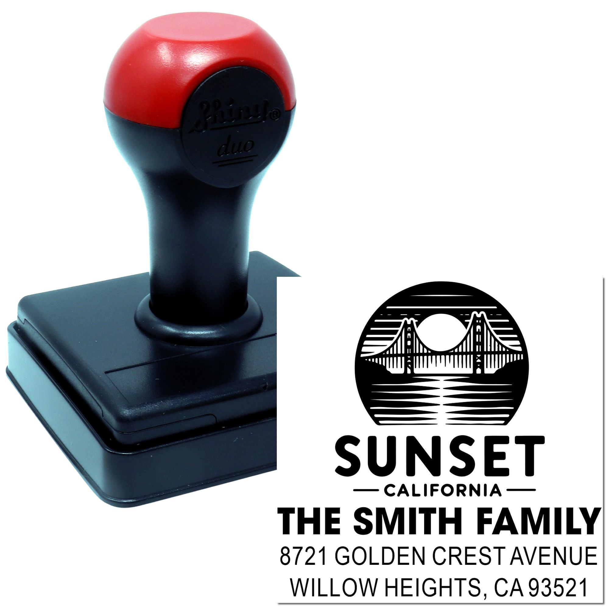 Custom self-inking rubber address stamp with Sunset California bridge logo, family name, and mailing address for mail and packaging.