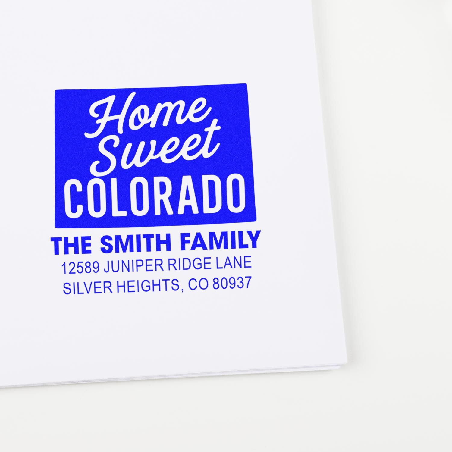 Custom home address rubber stamp reading Home Sweet Colorado for The Smith Family in Silver Heights, CO.