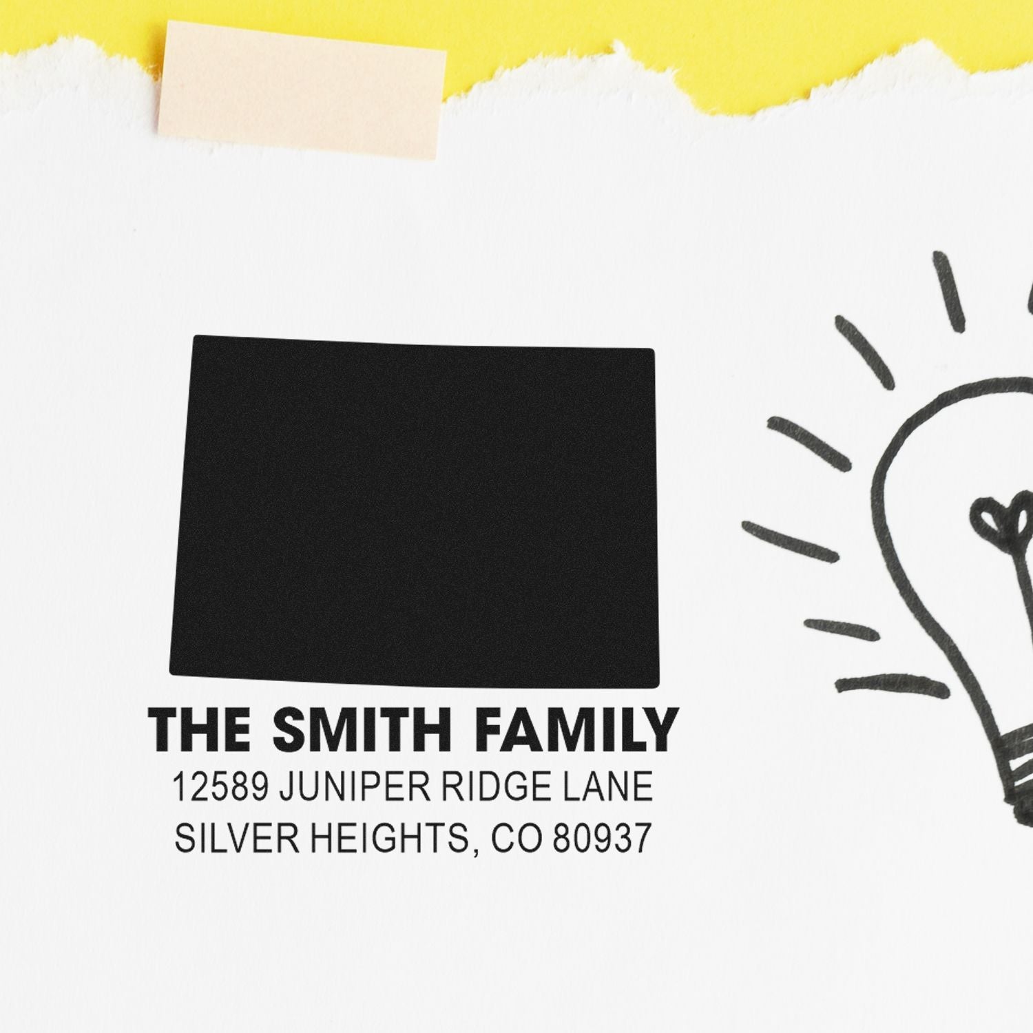 Custom return address rubber stamp for The Smith Family with address in Silver Heights, CO on a clean mockup.