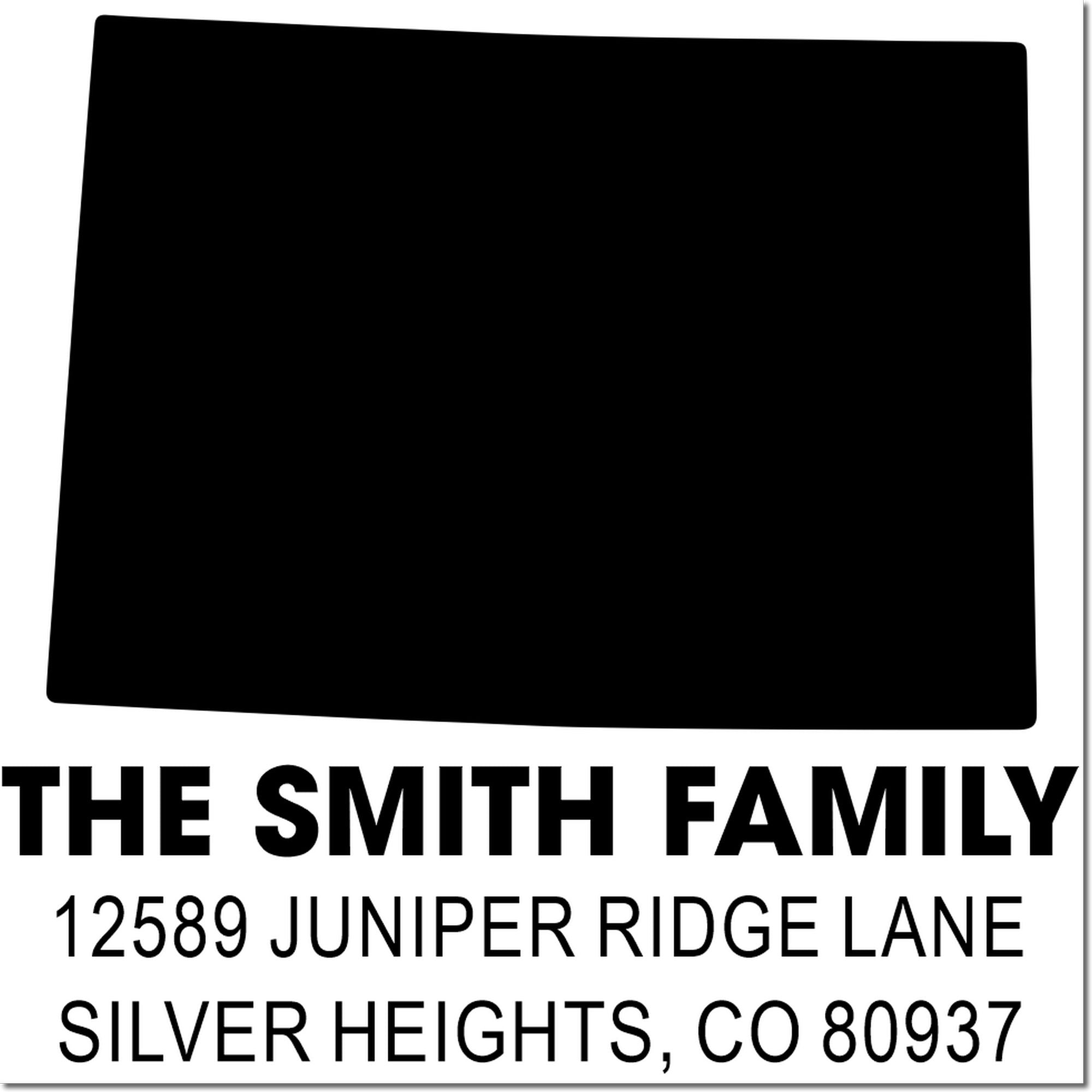 Custom return address rubber stamp for The Smith Family with logo block and Silver Heights, CO 80937 address.