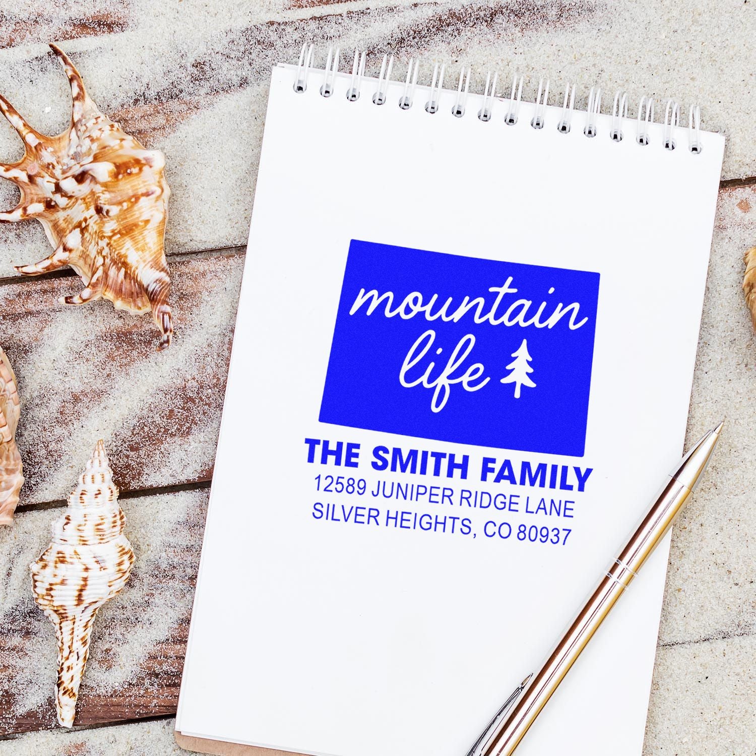 Custom mountain life return address rubber stamp with family name and address for personalized stationery and mail.