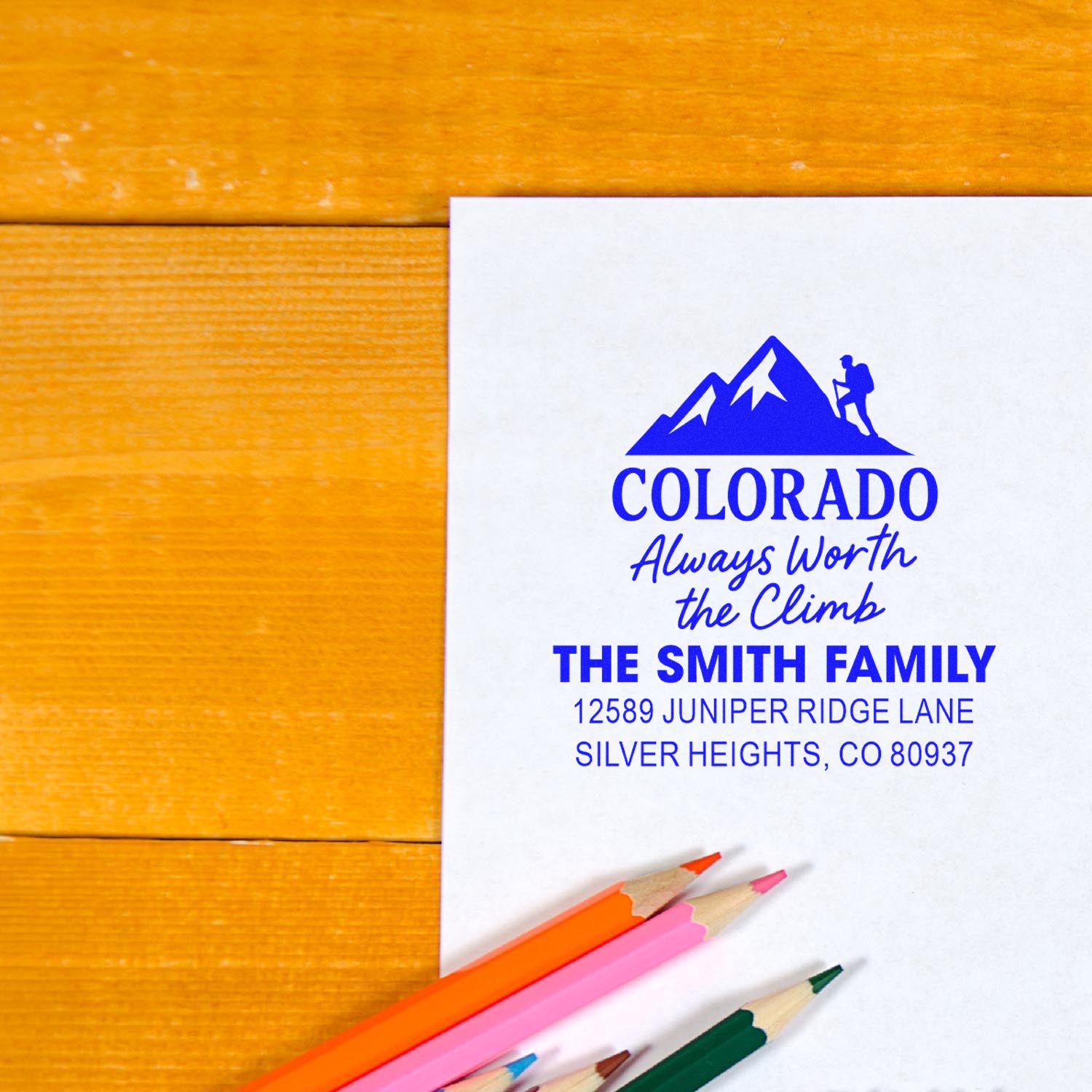 Custom Colorado return address rubber stamp with mountain logo, family name, and address for personalized stationery.