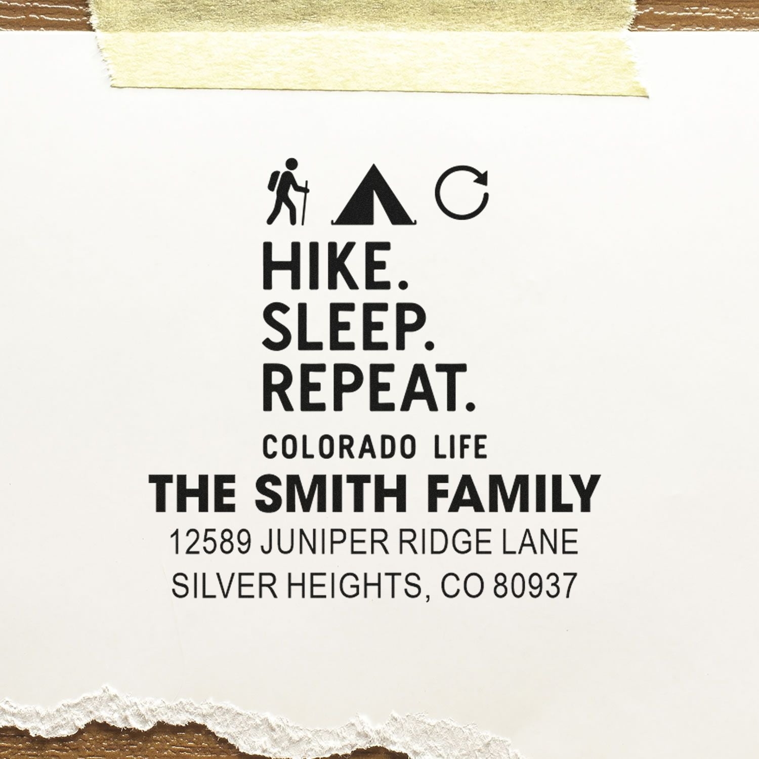Custom return address rubber stamp for The Smith Family, with hike sleep repeat slogan and Colorado address.
