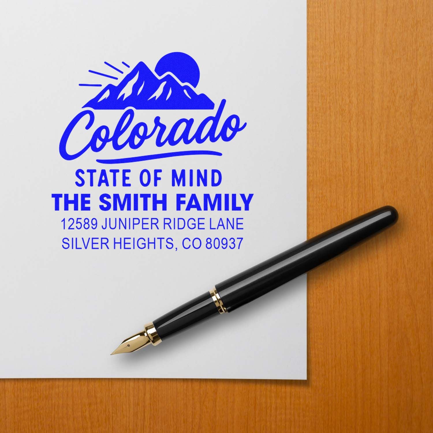 Custom Colorado return address rubber stamp with mountain logo for The Smith Family, Silver Heights, CO 80937.