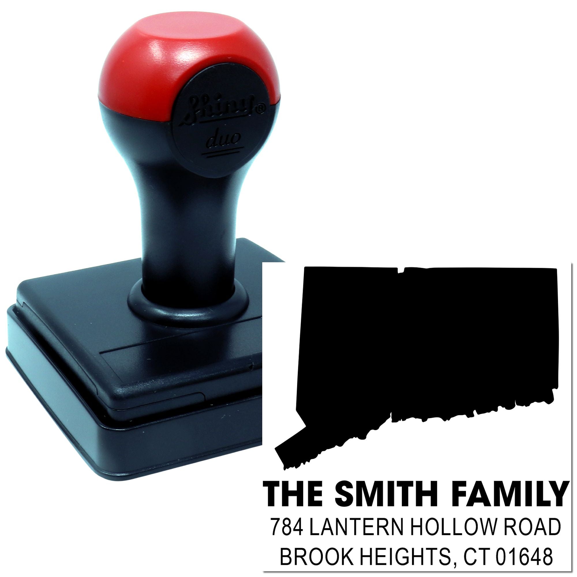 Custom self-inking rubber address stamp with family name and return address imprint for mailing.