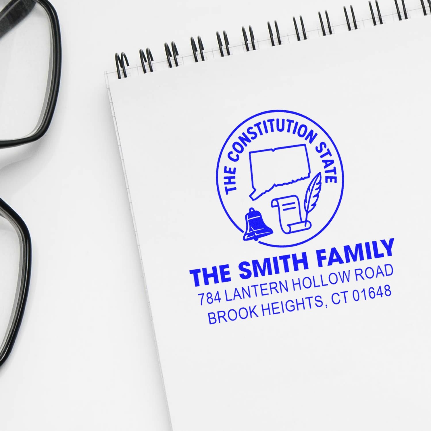 Personalized address rubber stamp with Connecticut Constitution State logo and family name for stationery.