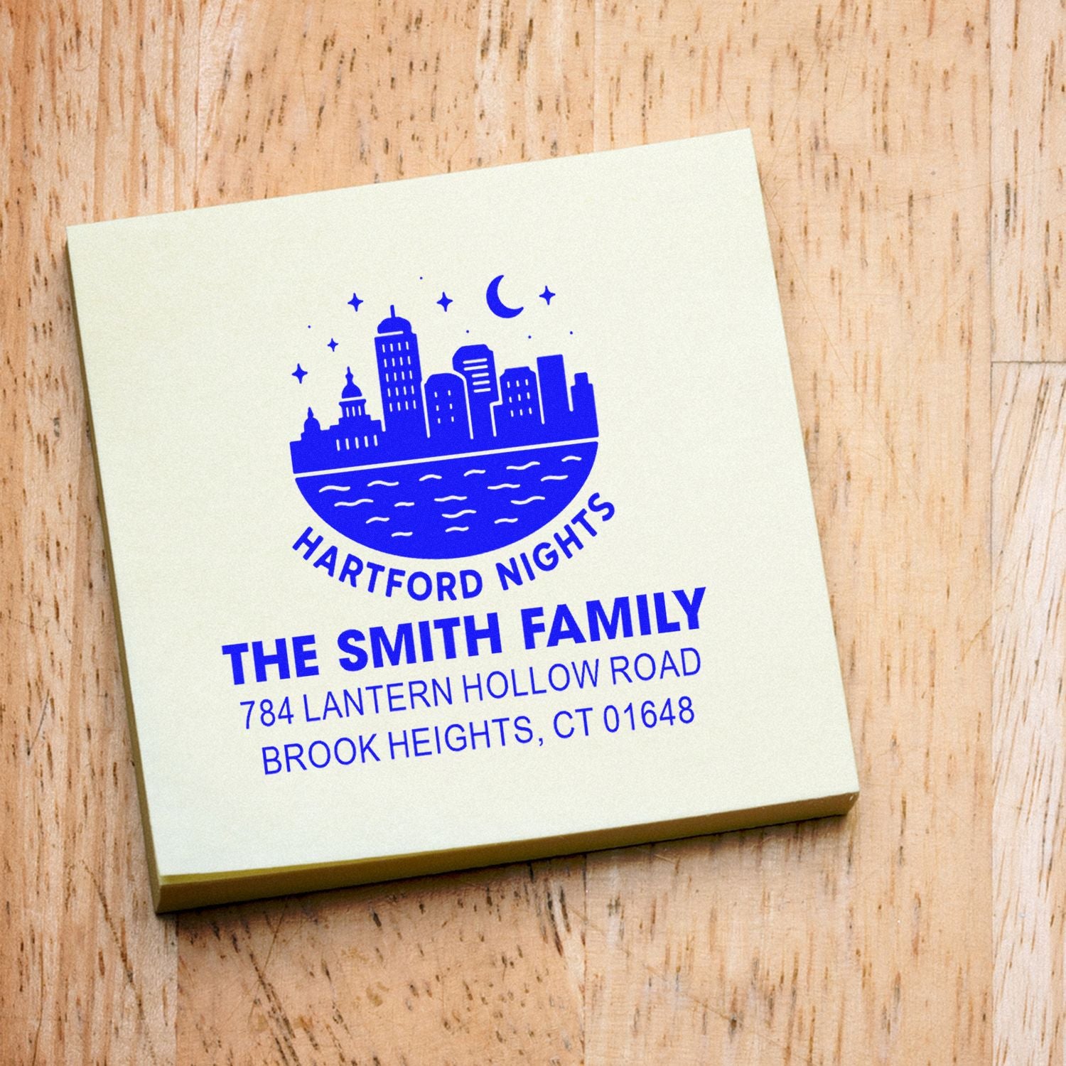 Custom rubber address stamp for The Smith Family with Hartford Nights skyline logo and Brook Heights, CT return address.