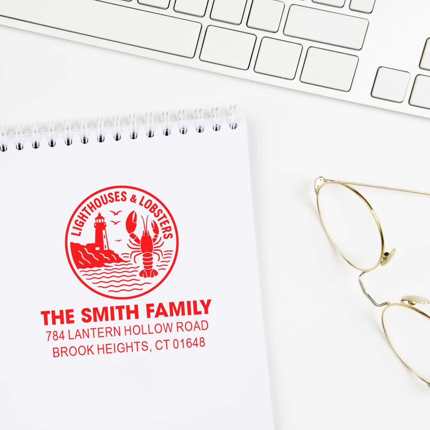 Personalized coastal return address rubber stamp with lighthouse and lobster design for The Smith Family, Brook Heights, CT.