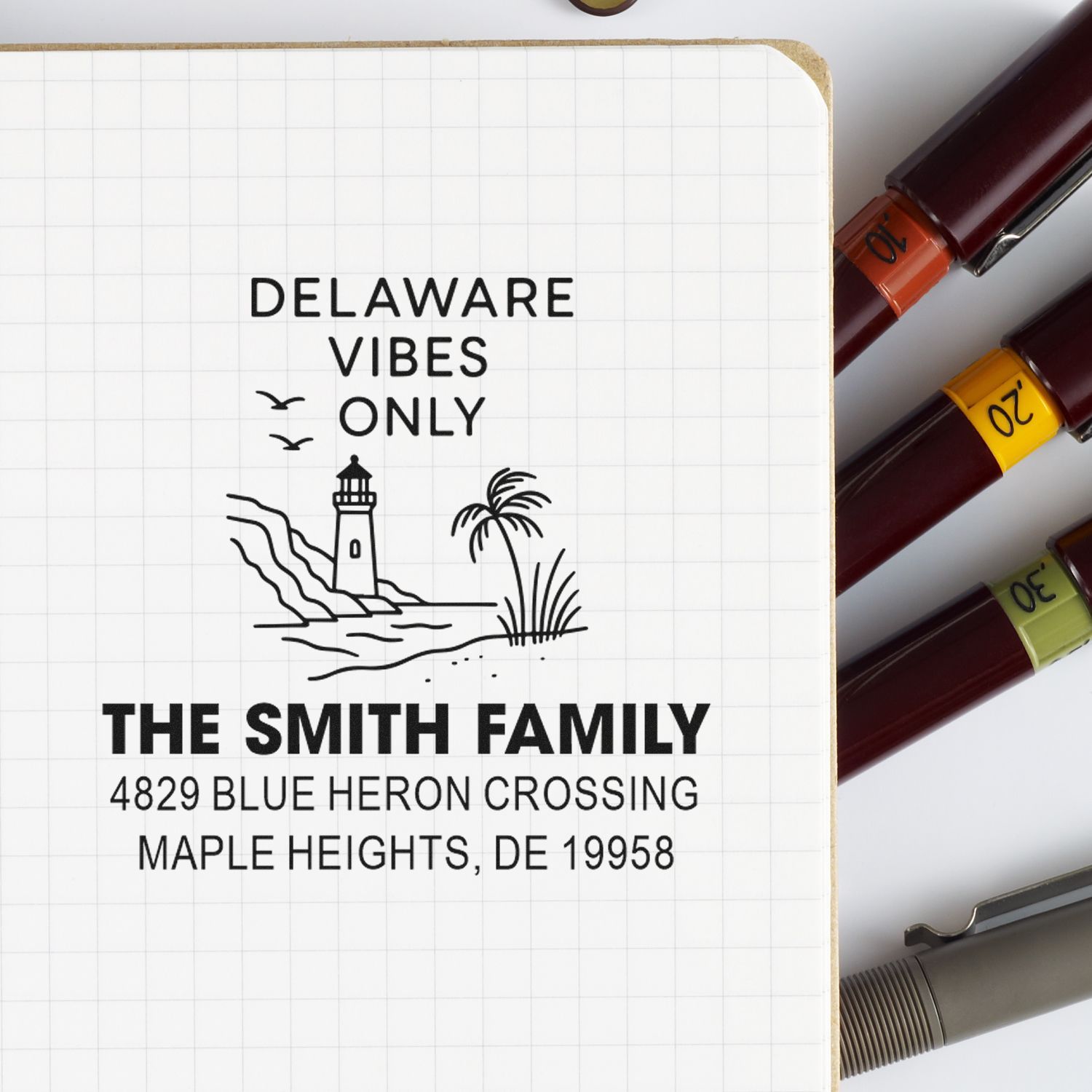 Custom rubber address stamp for The Smith Family with Delaware Vibes Only lighthouse design and Maple Heights, DE address.