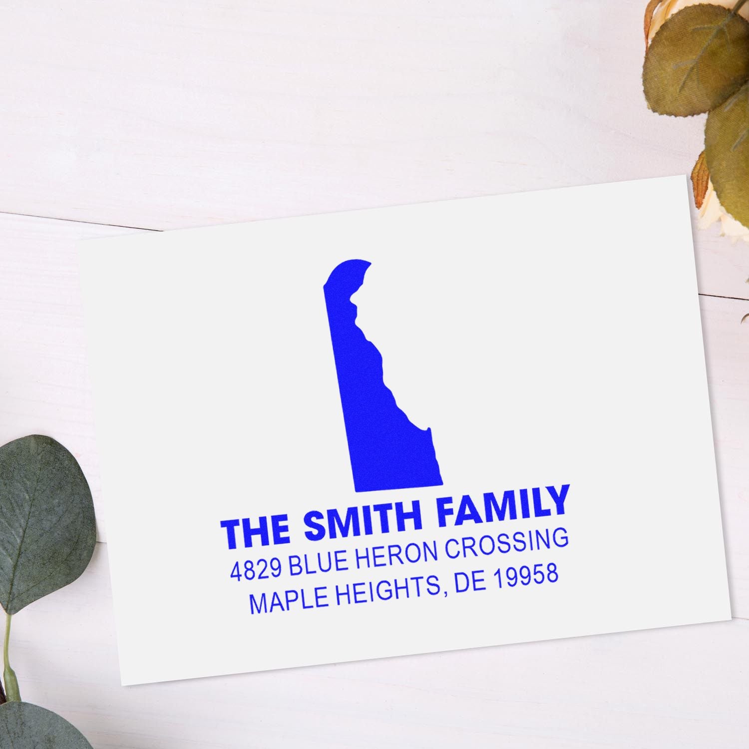 Custom Delaware return address rubber stamp for The Smith Family, with address and blue state silhouette.
