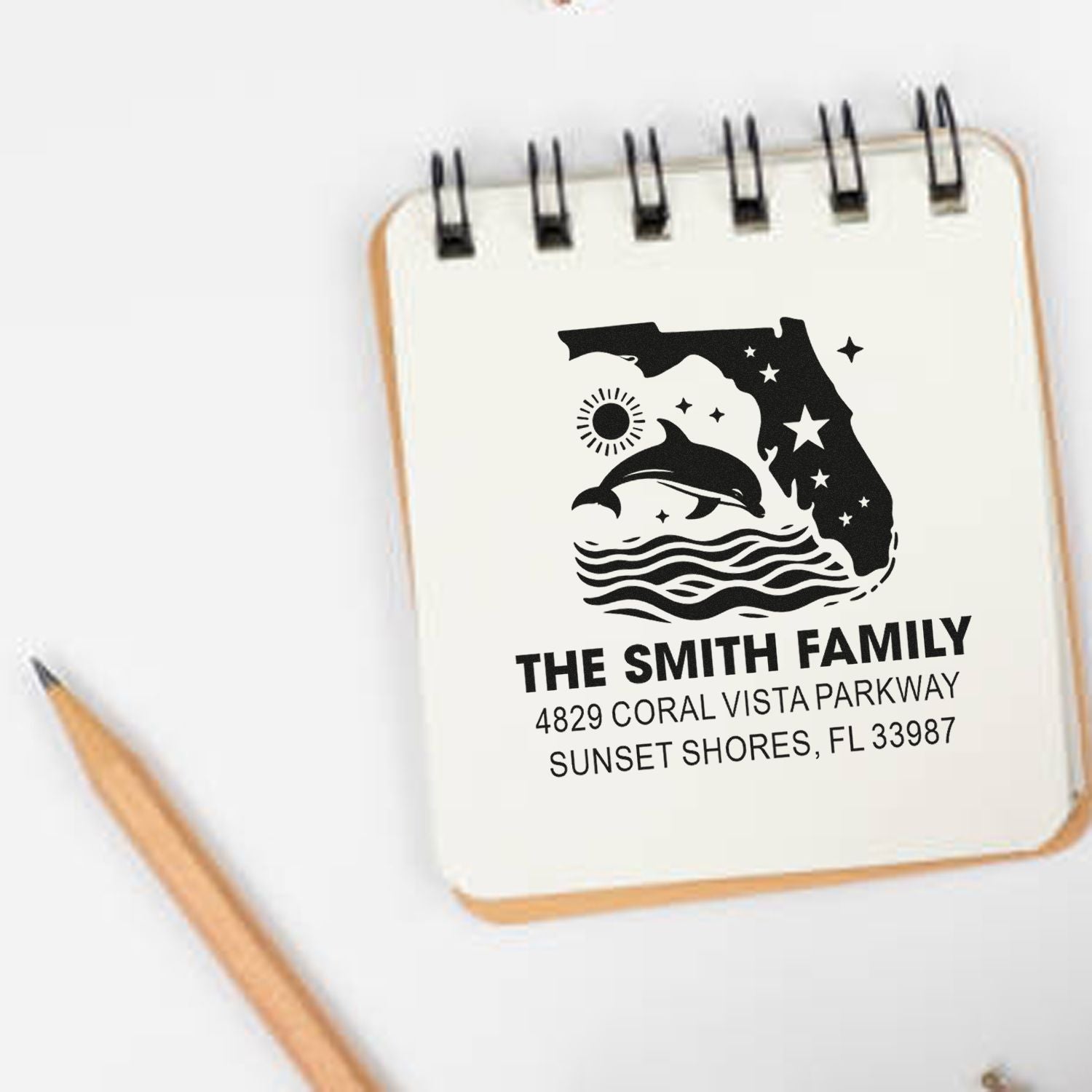 Custom Florida family address rubber stamp with dolphin and waves, featuring name and return address for personalized mail.