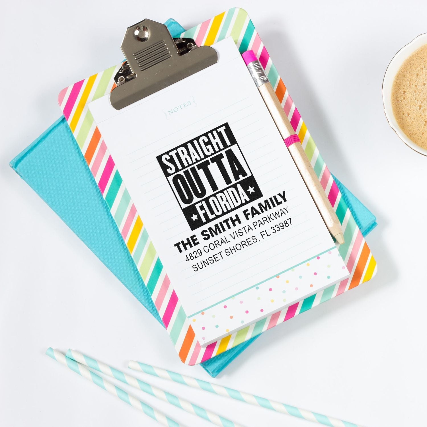 Custom return address rubber stamp mockup on clipboard with colorful stationery and pencil, showing Straight Outta Florida family address design.