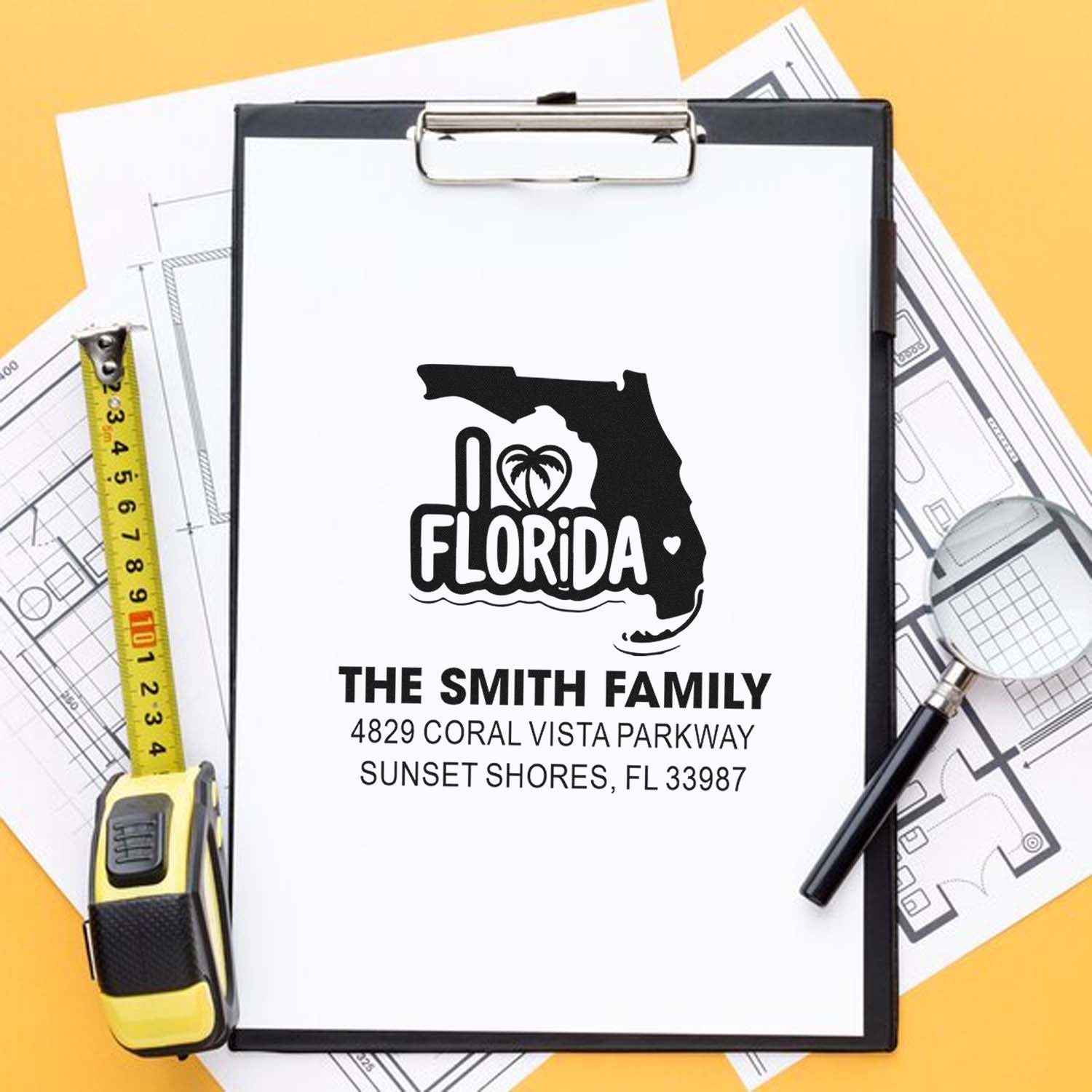 Personalized Florida family return address rubber stamp design on clipboard with home blueprint.