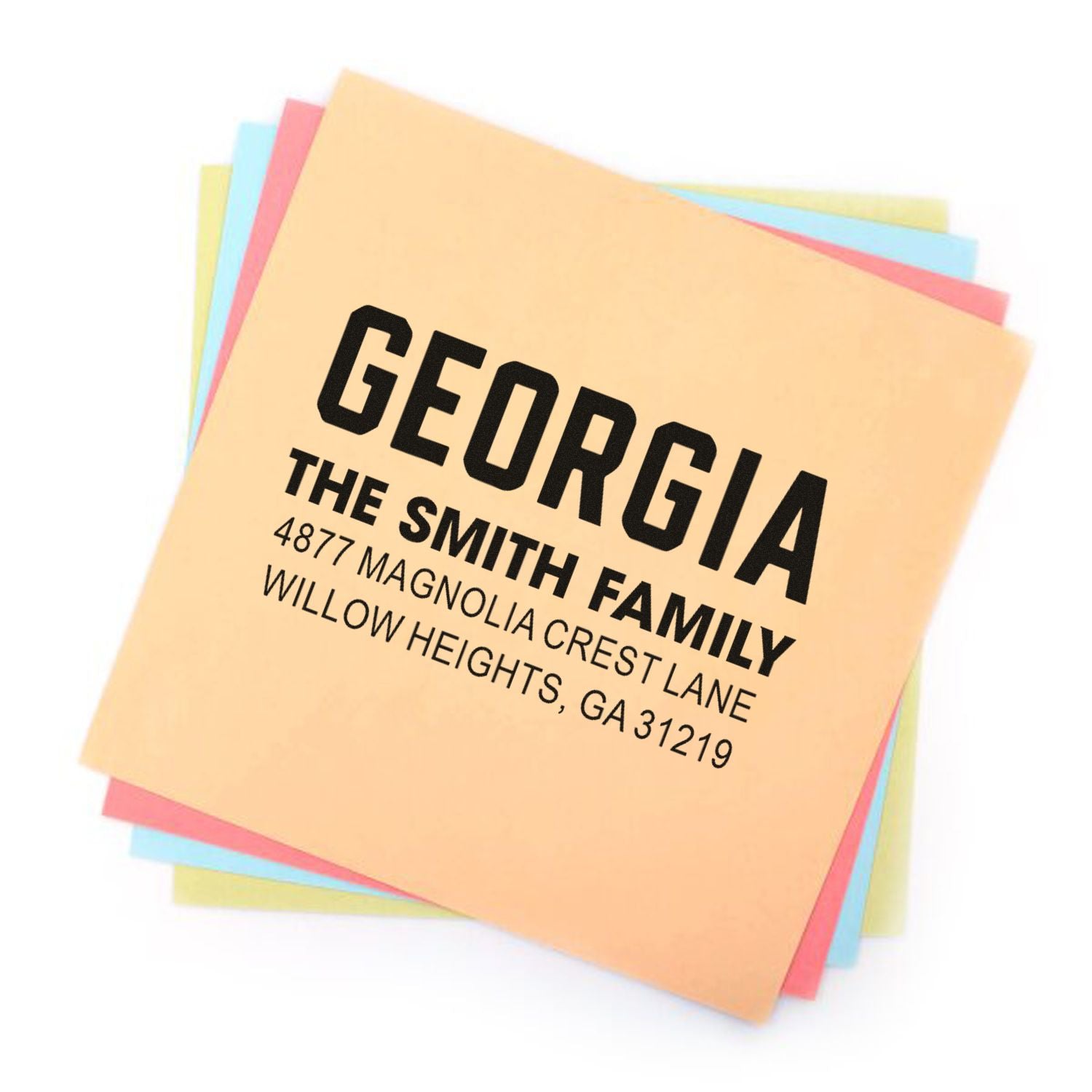Personalized custom return address rubber stamp for the Smith family, with Georgia address on colorful paper samples.