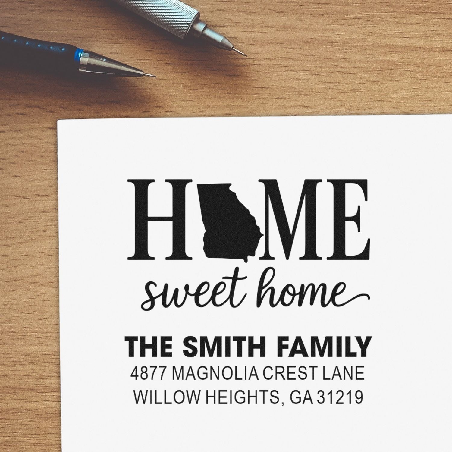 Personalized home sweet home rubber stamp with family name and address for custom return mailing.