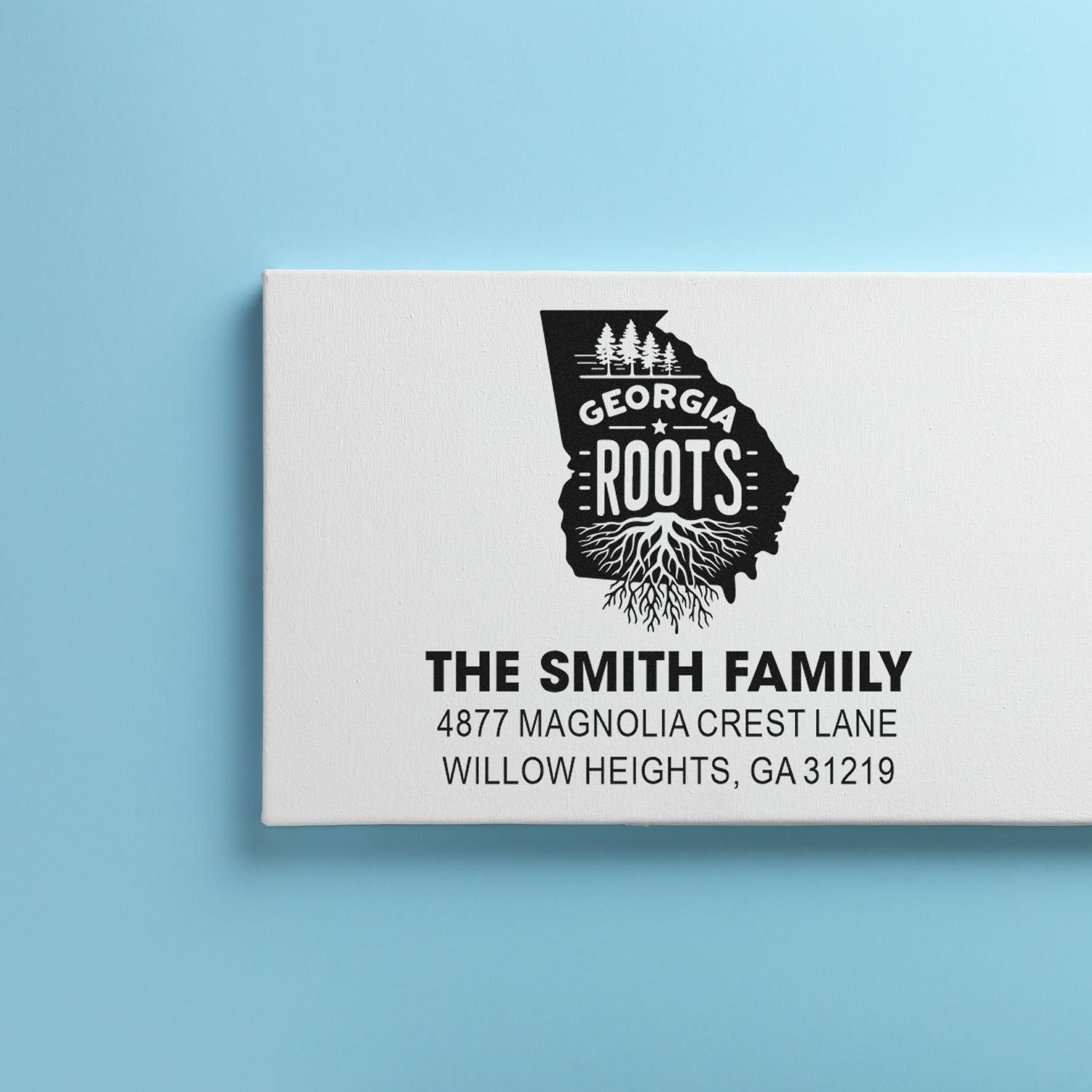 Custom rubber stamp featuring Georgia Roots design with The Smith Family return address and home address.