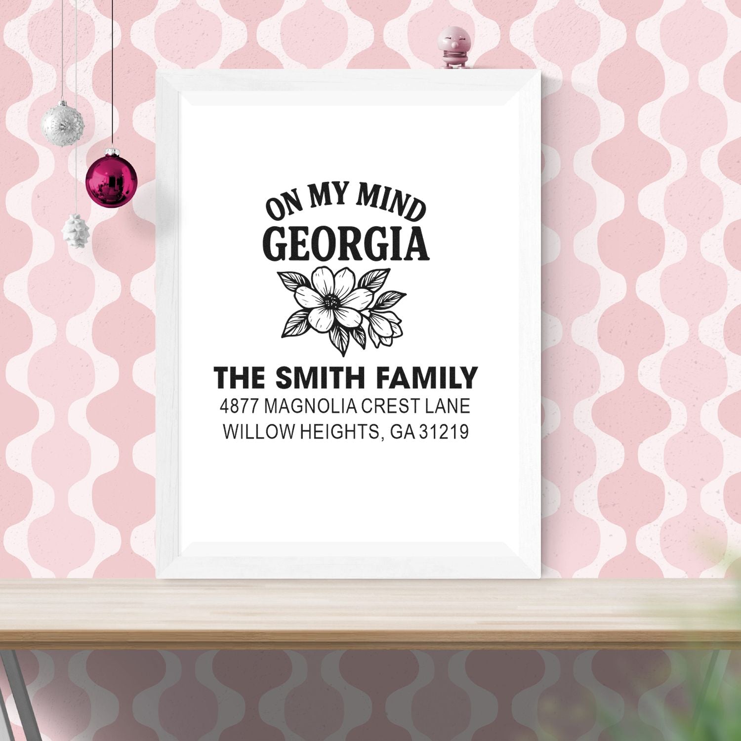 Custom rubber address stamp design for The Smith Family in Georgia with floral accent and personalized return address.