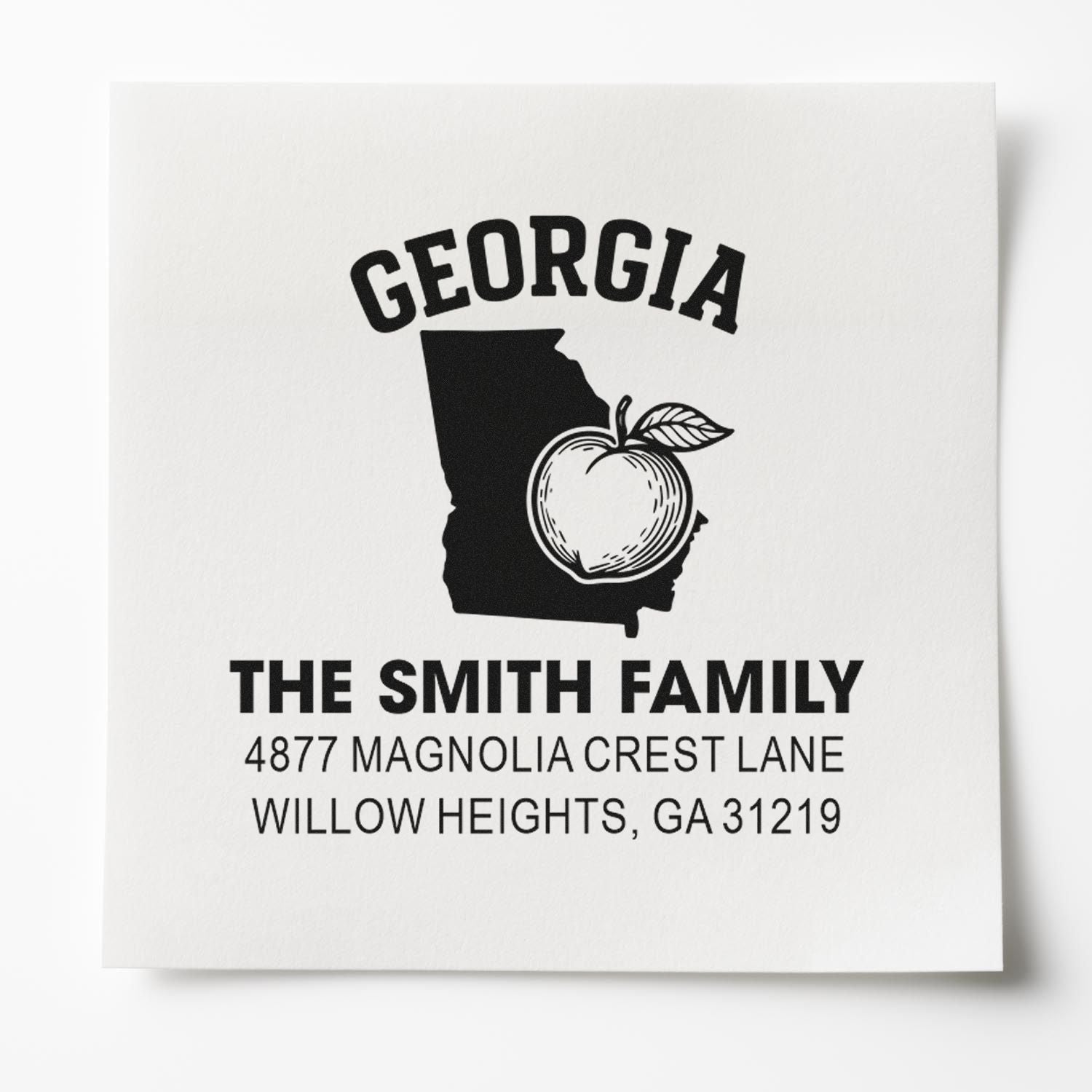 Personalized Georgia return address rubber stamp for The Smith Family with state outline, apple icon, and mailing address.