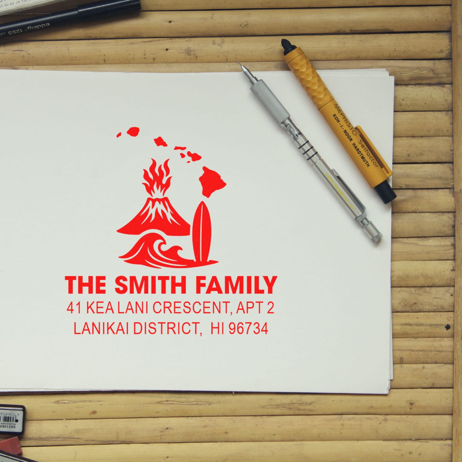 Personalized rubber address stamp for The Smith Family with Hawaii volcano and surfboard design on white paper.