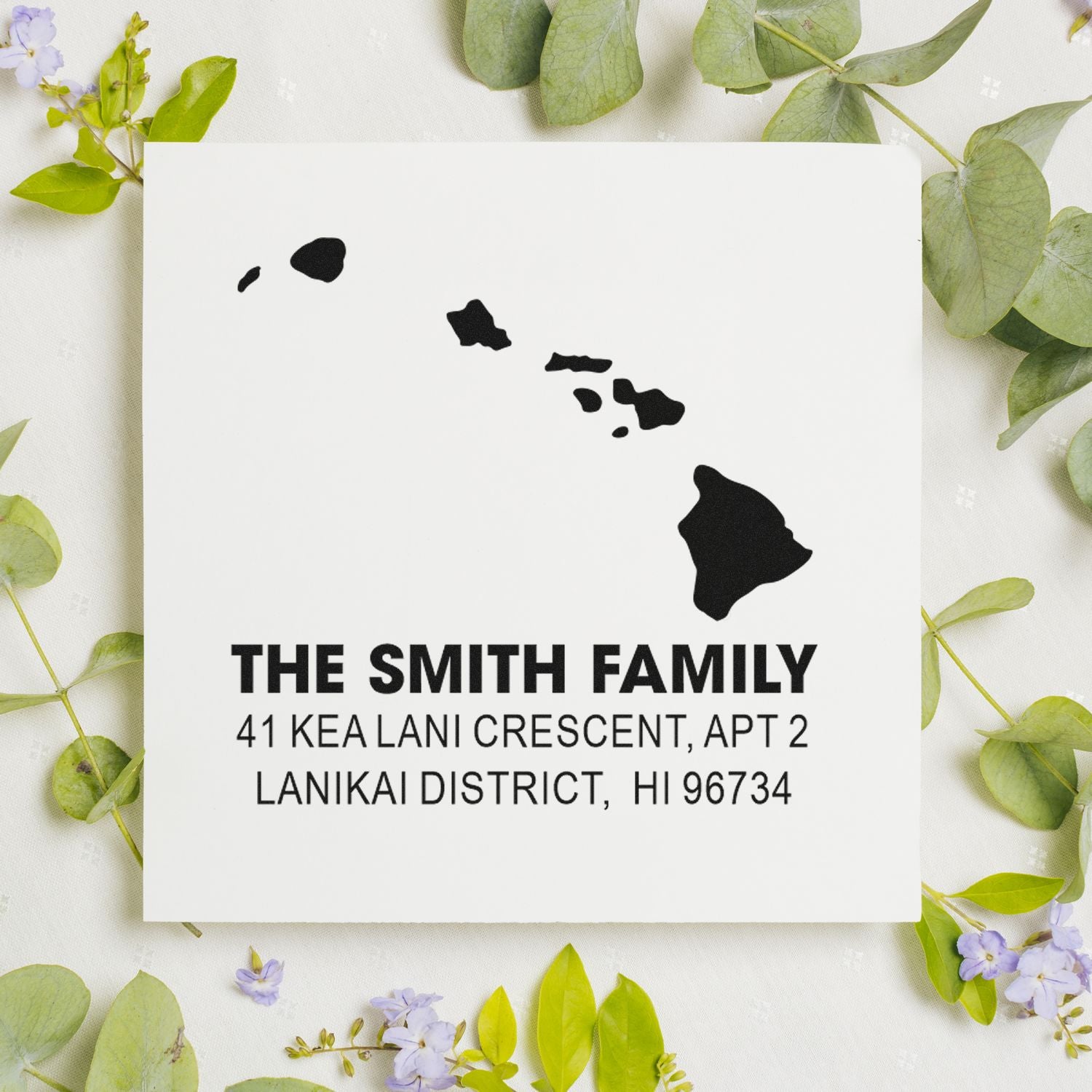 Custom return address rubber stamp with Hawaii island map, Smith family name, and Lanikai District address for envelopes.