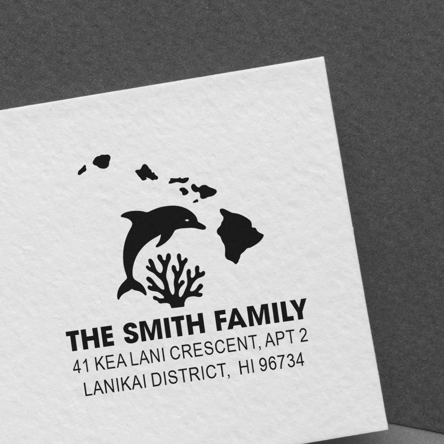 Custom family address rubber stamp with dolphin and Hawaii island design for mail, stationery, and envelopes.