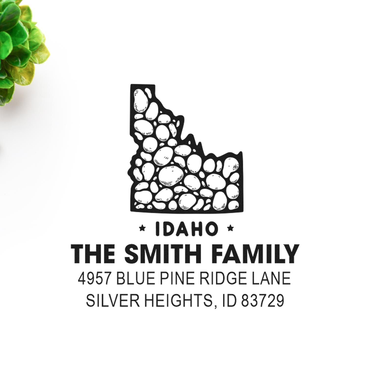 Custom Idaho return address rubber stamp for The Smith Family, Silver Heights, ID 83729, with stone-filled state silhouette.