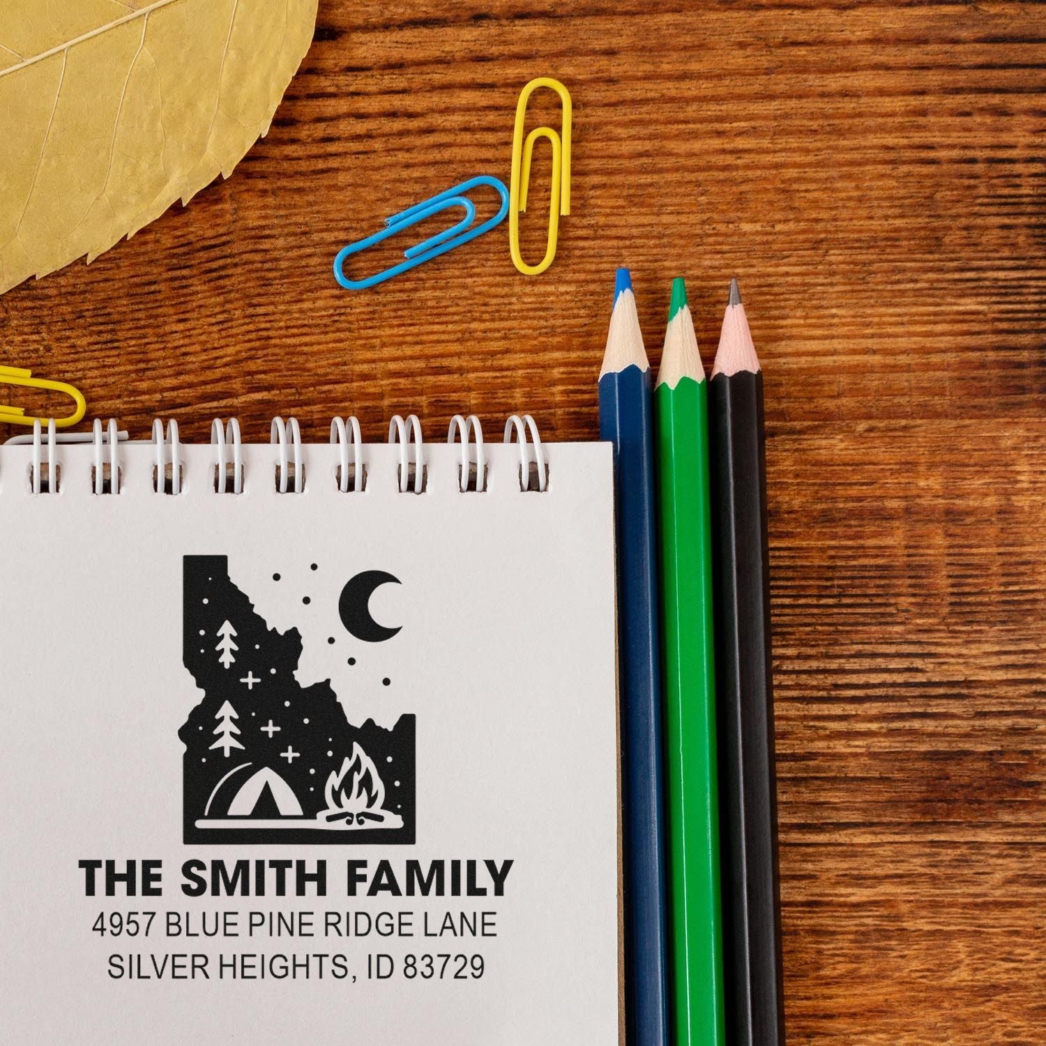 Custom family address rubber stamp with Idaho camping logo for personalized mail, envelopes, and stationery.