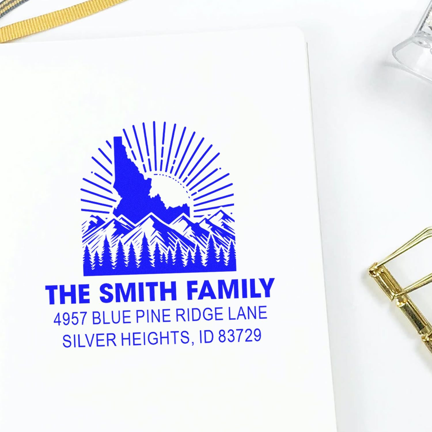 Custom rubber stamp with mountain logo and return address for The Smith Family, ideal for personalized envelopes and packaging.