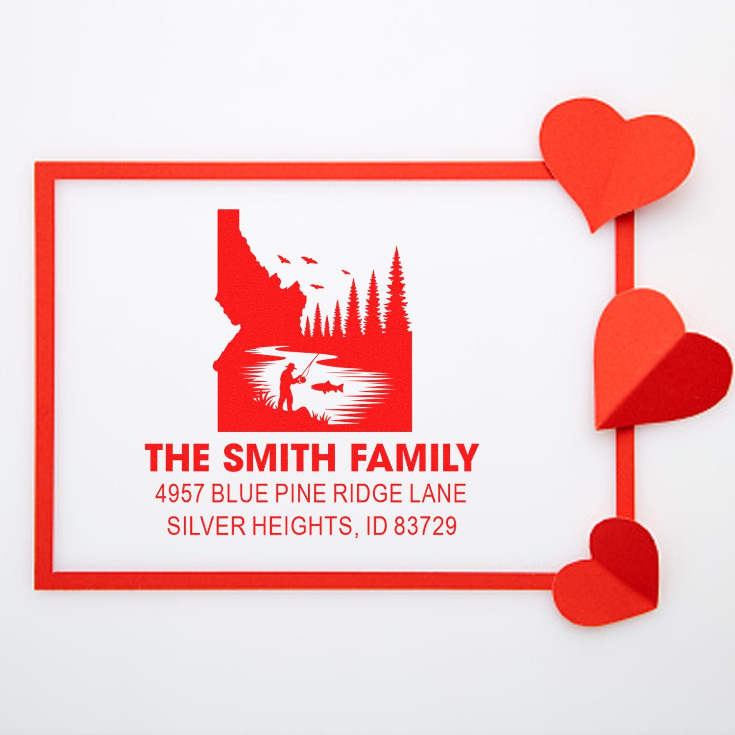 Custom return address rubber stamp for The Smith Family with fishing-themed design and heart border.
