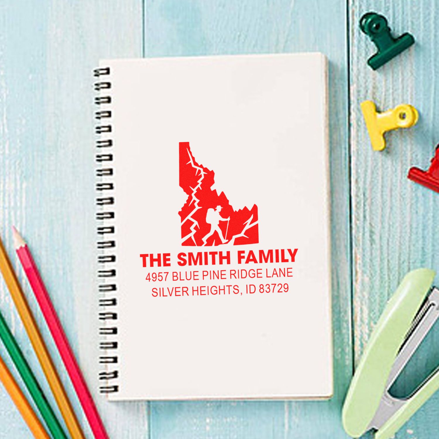 Custom family return address rubber stamp with hiking silhouette on notebook cover
