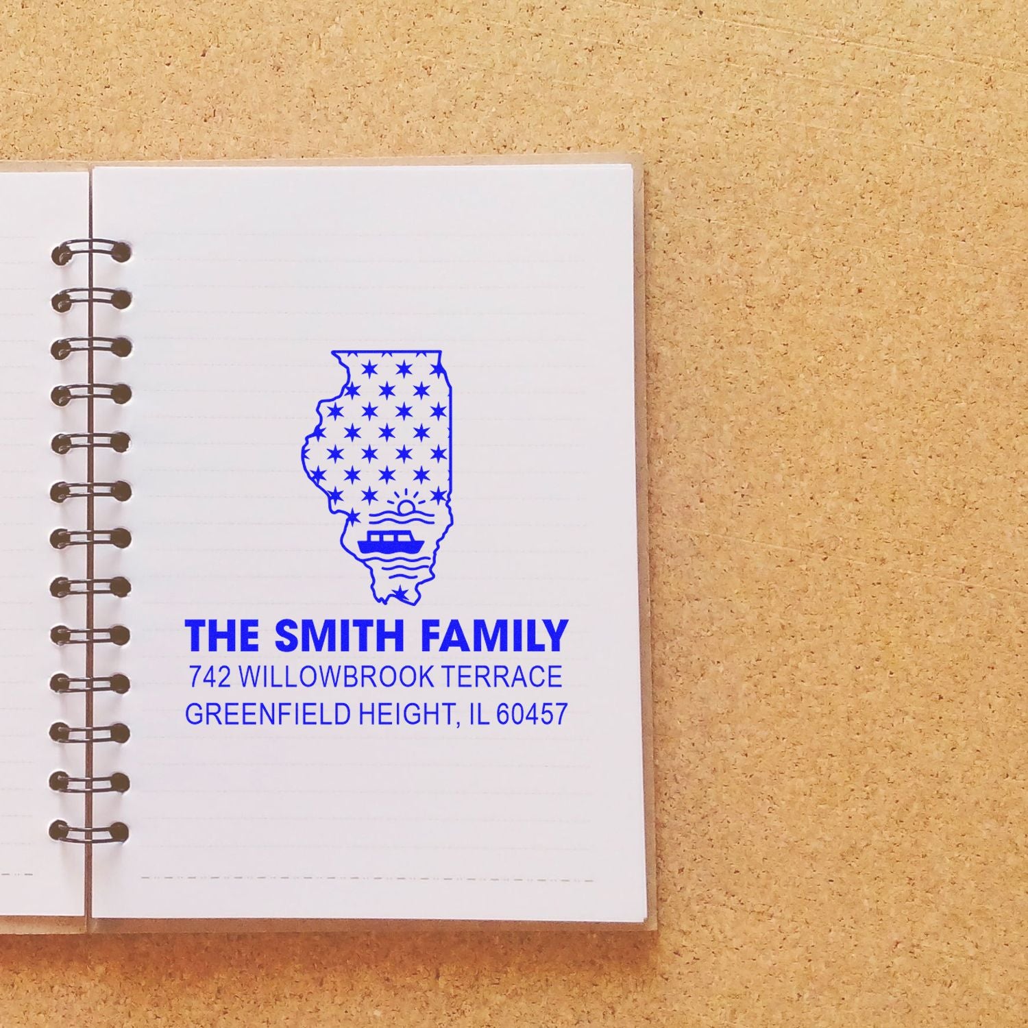 Custom Illinois family address rubber stamp on notebook page with The Smith Family and full mailing address.