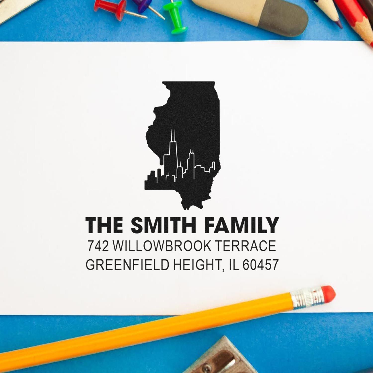 Custom return address rubber stamp with Illinois skyline design and personalized family name for envelopes and stationery.