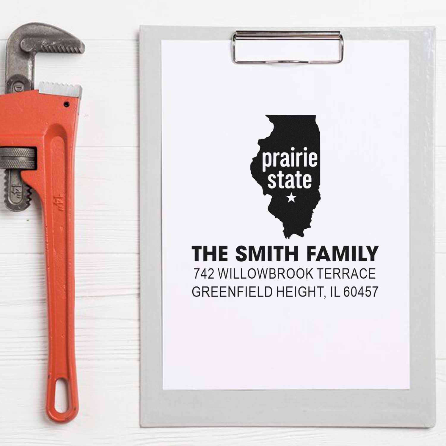 Custom Illinois return address rubber stamp design with Prairie State silhouette and Smith family address on a clipboard.