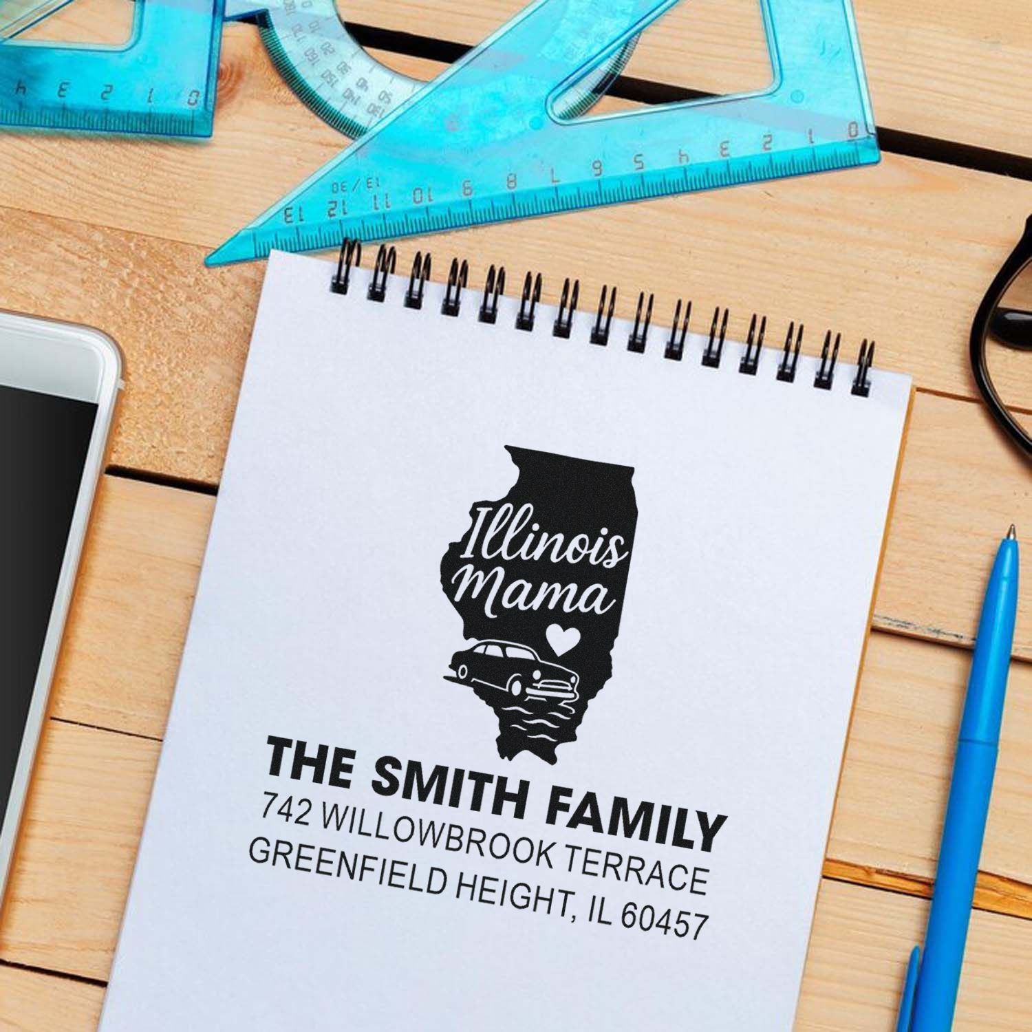 Personalized Illinois Mama family return address rubber stamp design mockup with custom name and address on a notepad