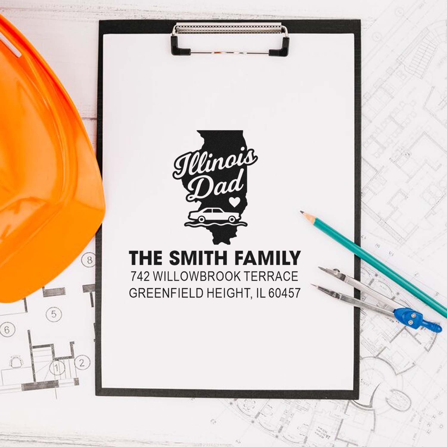 Custom Illinois Dad rubber stamp design with family name and address, shown on a clipboard with blueprint tools and hard hat.