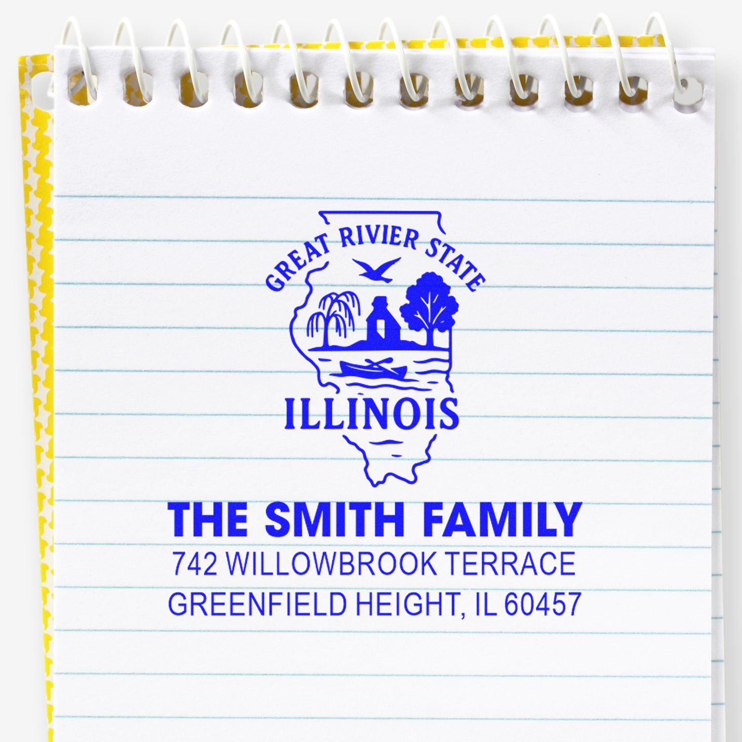 Custom Illinois return address rubber stamp with family name and address imprint on lined notebook paper