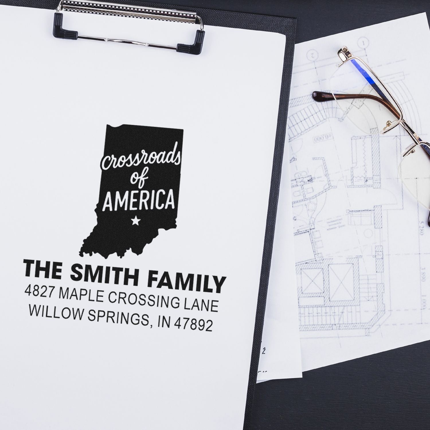Custom return address rubber stamp with Indiana state silhouette, used for personalized family mail and stationery.