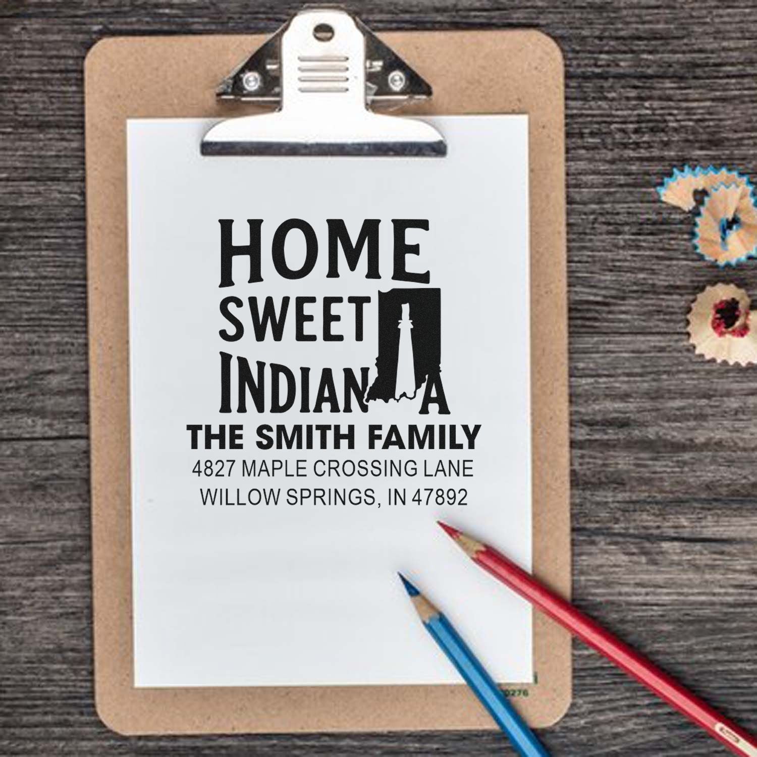 Custom Home Sweet Indiana rubber stamp with family name and return address on a clipboard.