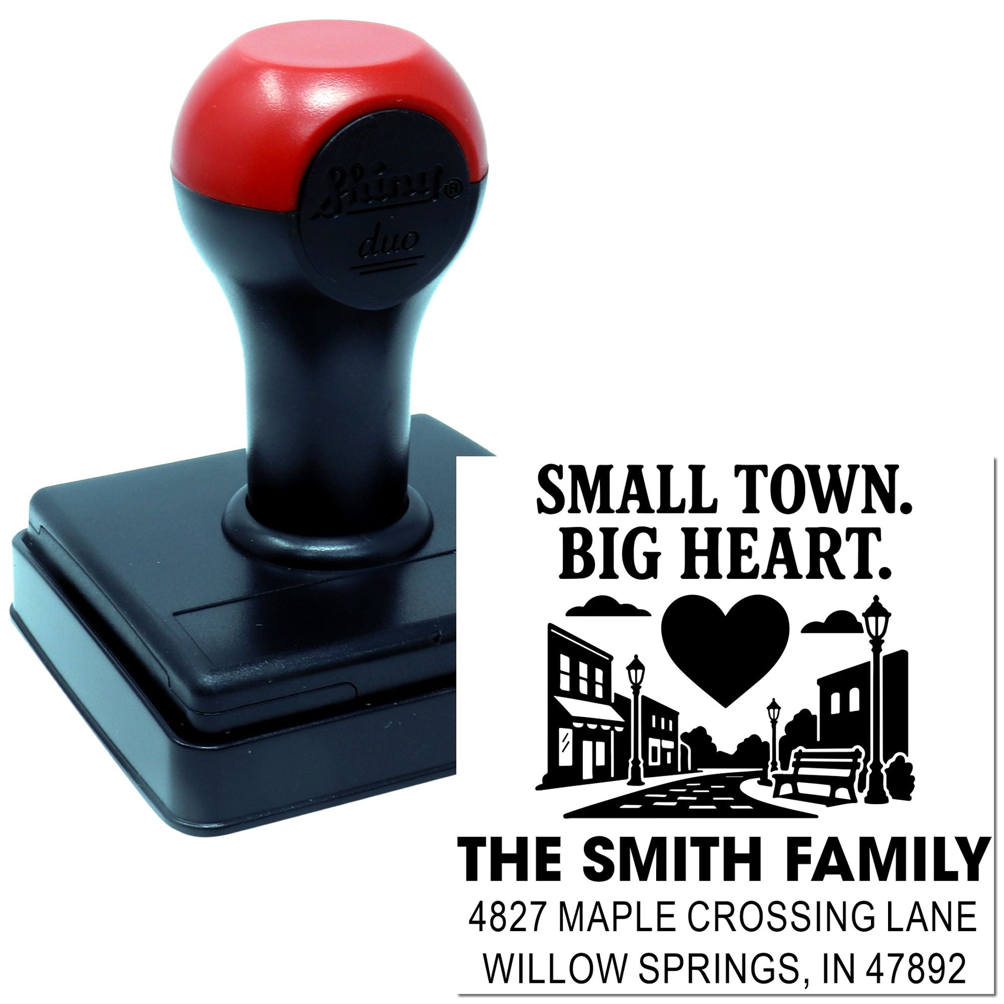 Custom self-inking rubber address stamp with Small Town, Big Heart family name and home address design.