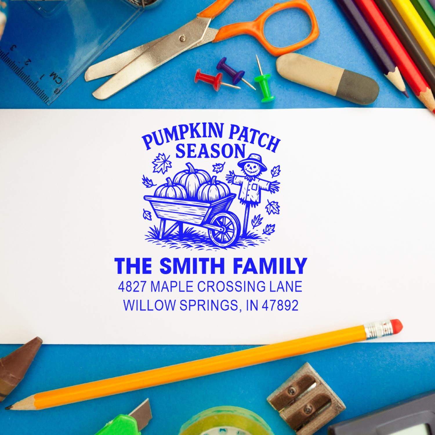 Custom rubber stamp imprint with Pumpkin Patch Season design, The Smith Family name, and address on paper.