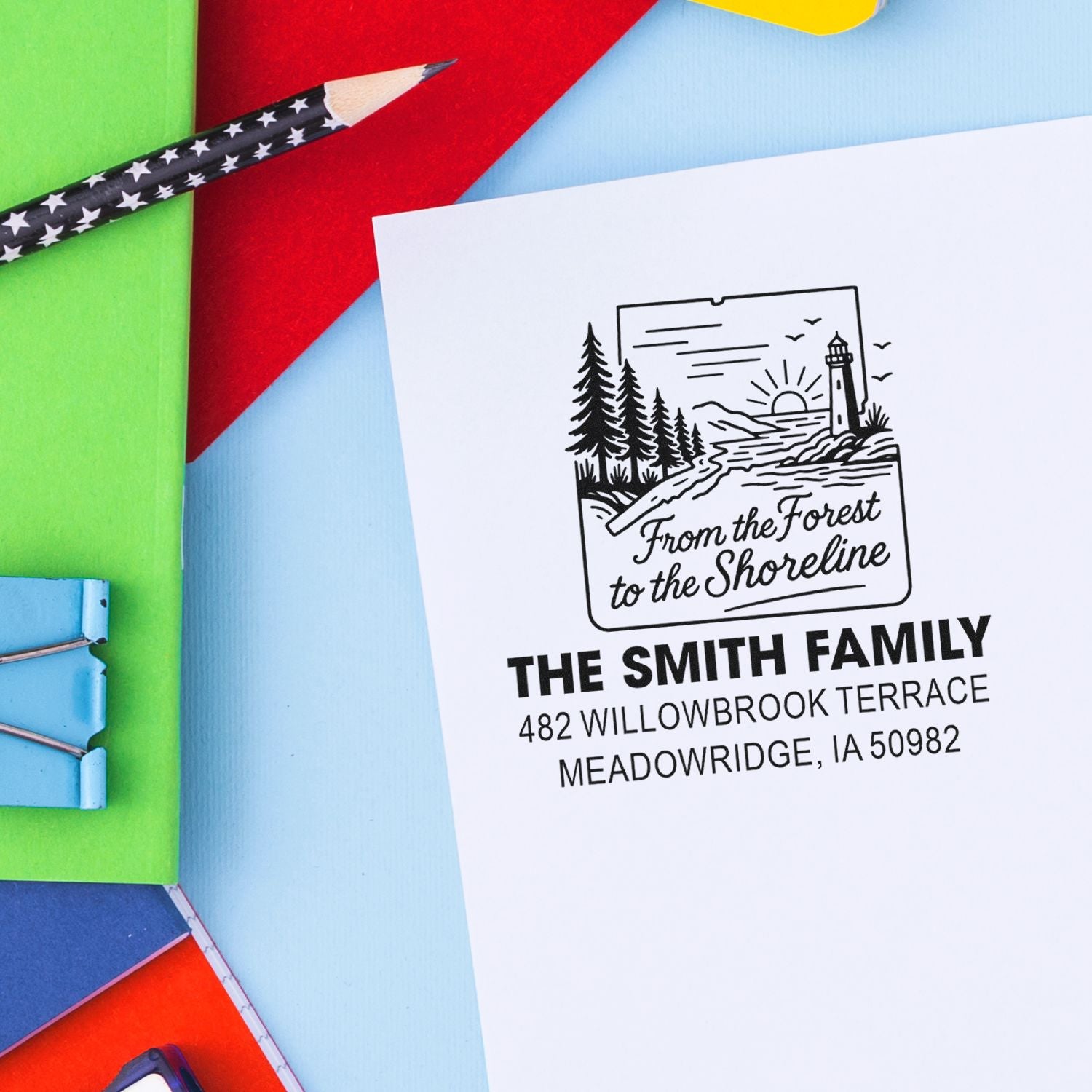 Custom rubber return address stamp with forest-to-shoreline design for The Smith Family, ideal for personalized mailing.